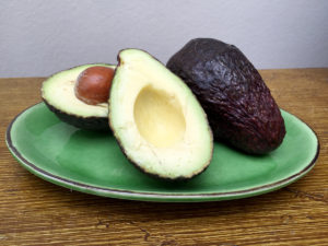 Avocadoes on Green Plate
