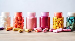 Colourful supplements in jars and on the table
