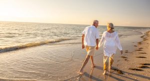 Couple Walking On Beach