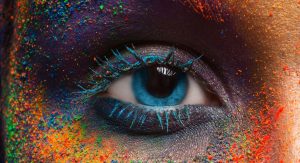 Eye Surrounded By Paint Pigments