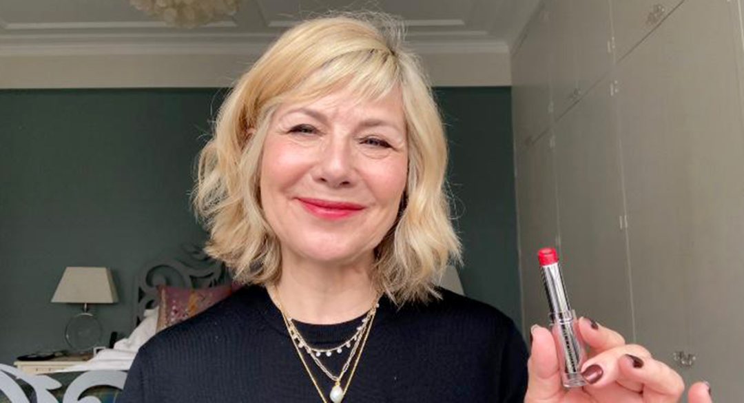 Glynis Holding Red Lipstick