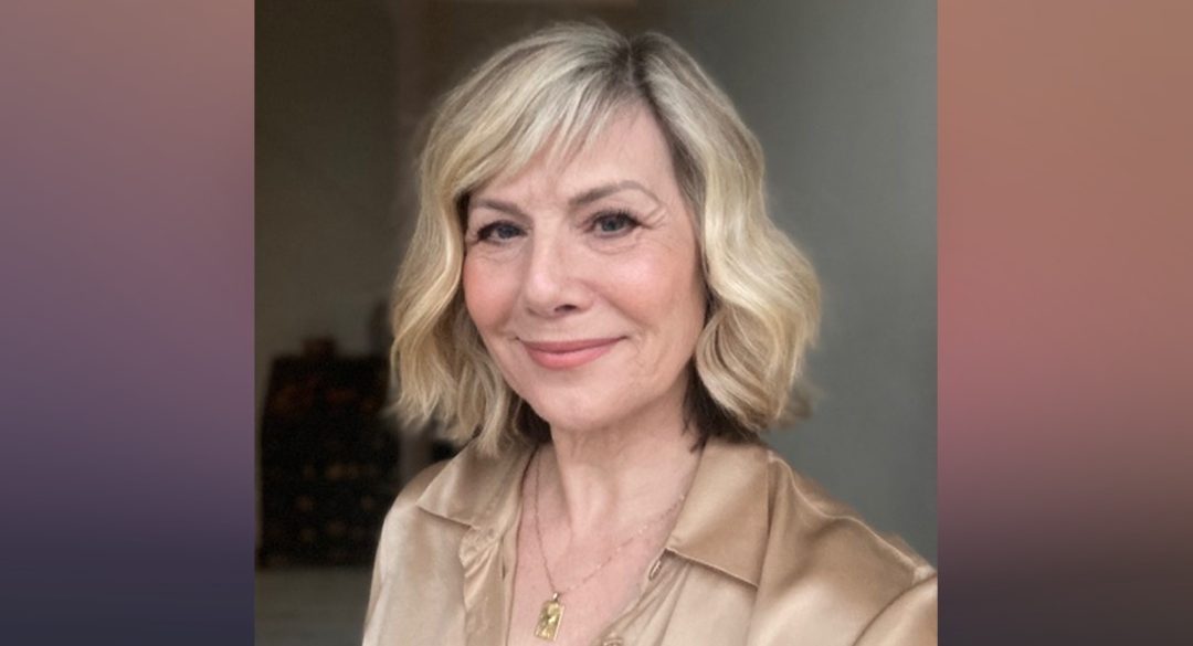 Glynis Wearing Gold Satin Shirt