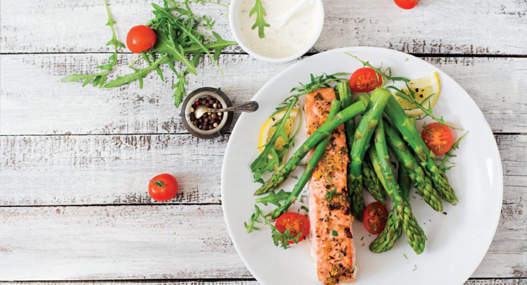 Salmon, Asparagus and Cherry Tomatoes on White Plate