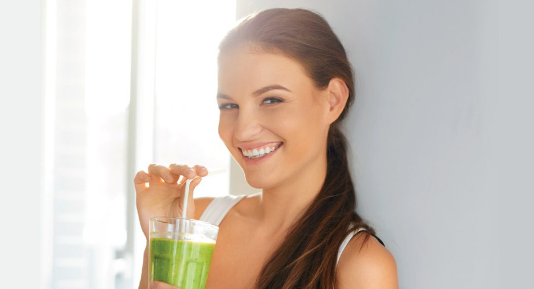 Smiling Woman with Green Juice