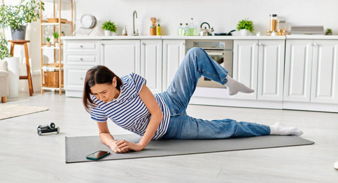 Woman Exercising While Checking Phone