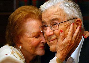 Elderly Couple Embrace