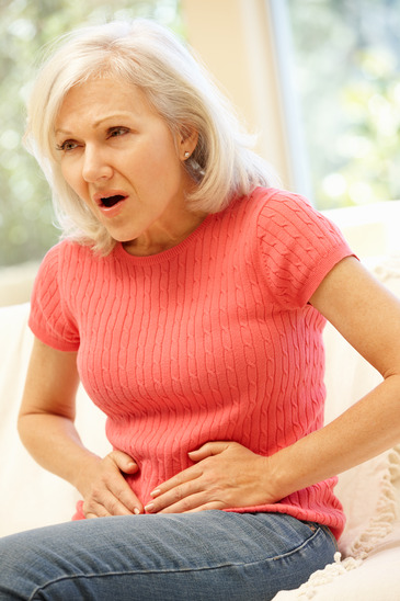 Mid age woman with stomach ache